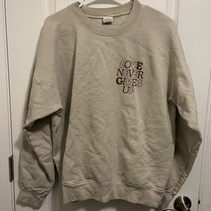 Long Sleeve Crewneck Beige Sweatshirt “Love Never Gives Up”